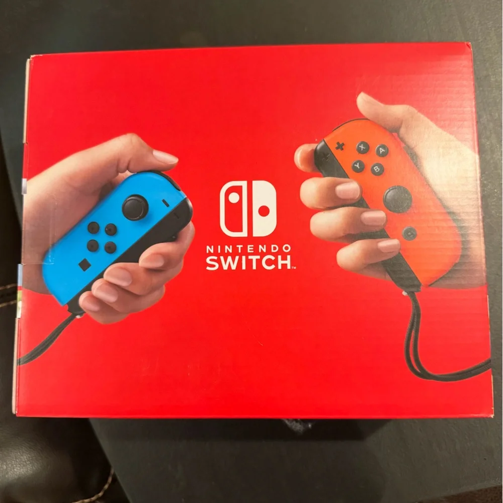 Nintendo Switch Console with Red and Blue Joy-Con (Brand new, never opened.)